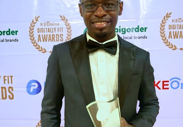 Joseph Kokumu poses with his award trophy at the Digitally Fit Awards 2023